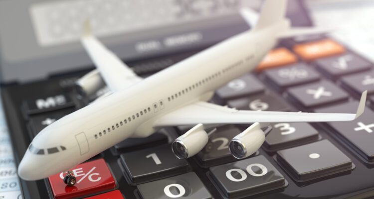 Traveler checking flight change costs on a mobile app at the airport