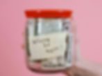 A jar with cash labeled 'Where to next?' symbolizing saving and budgeting for travel