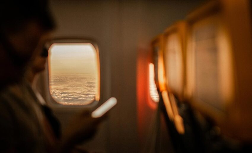 Business traveler at airport preparing for work trip
