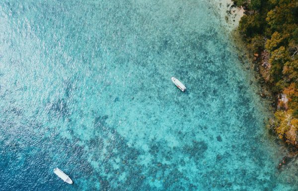 Passengers walking through an airport terminal, illustrating self-connecting between flights