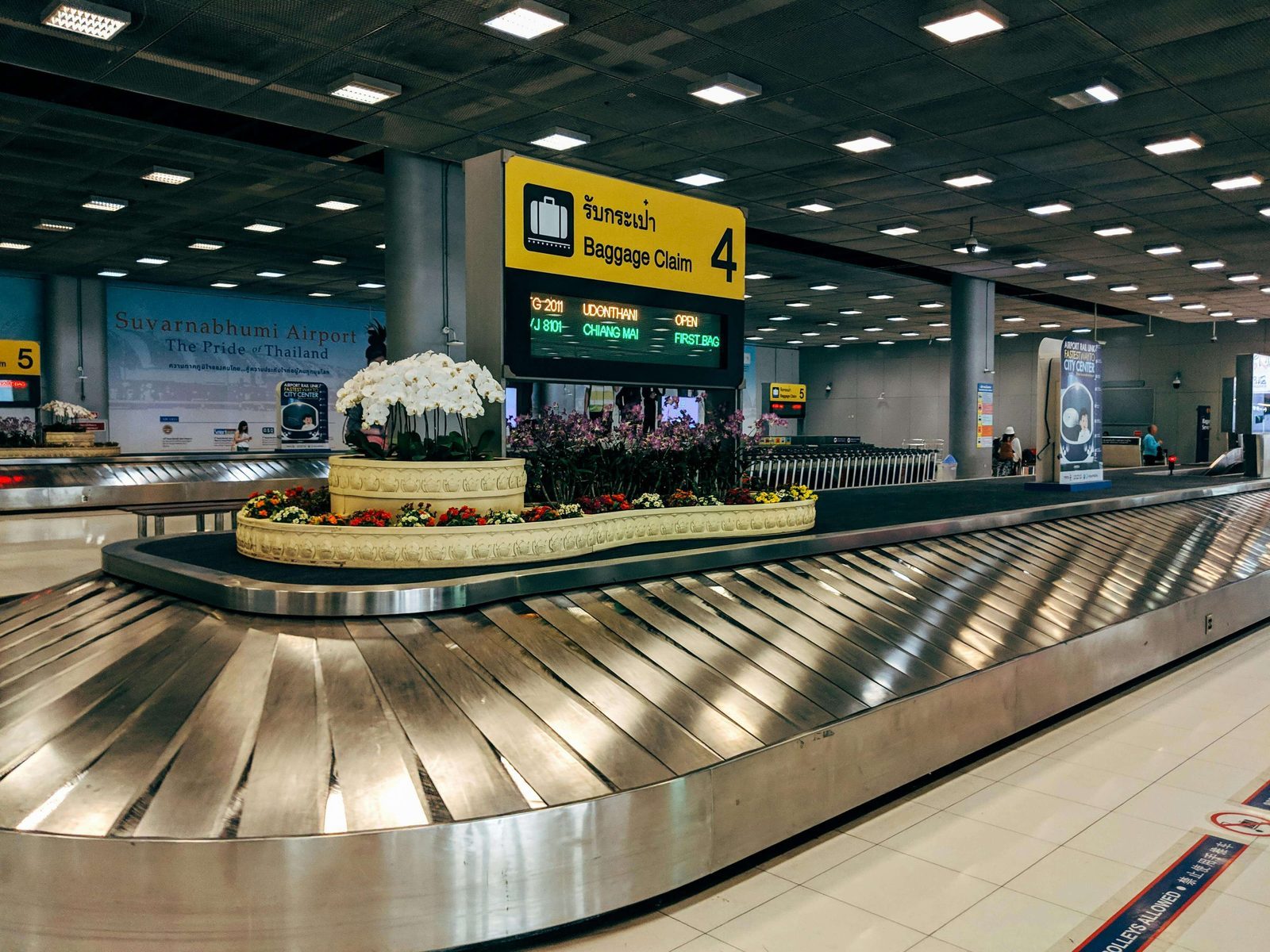 Suitcase on a scale, symbolizing the importance of tracking travel details and baggage
