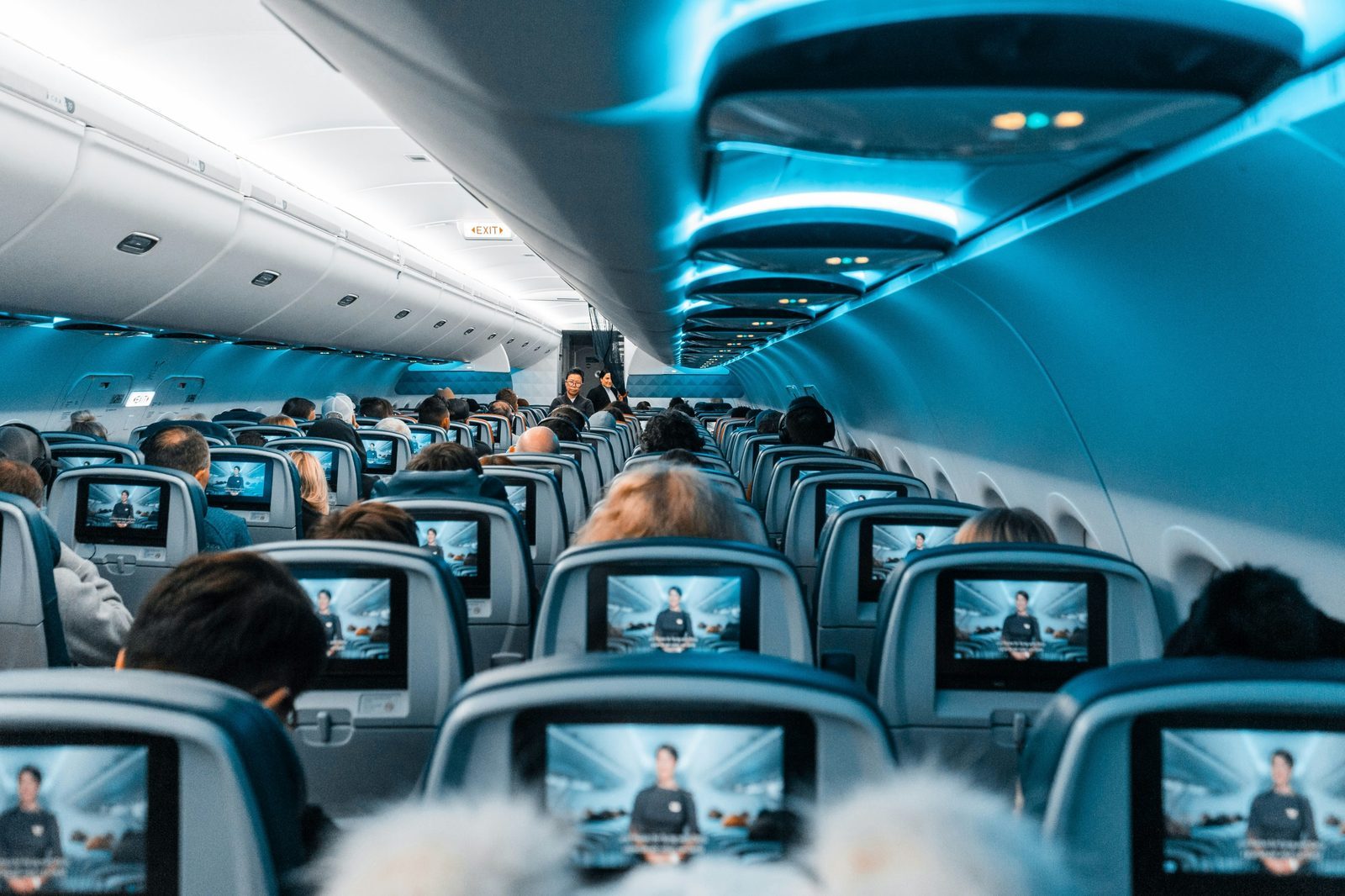 Airplane cabin view representing travelers deciding when to book flights