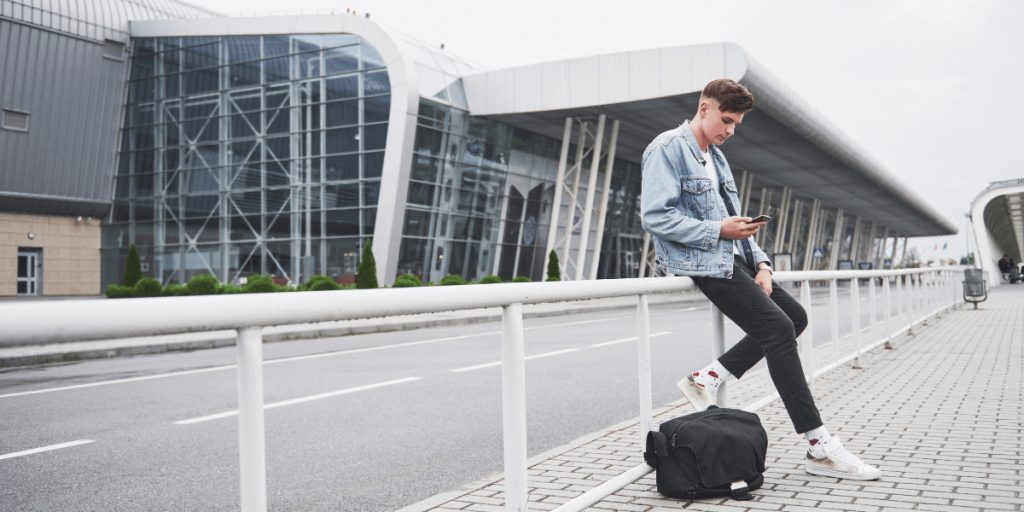 Traveler waiting calmly for an early-morning airport transfer