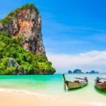 Backpacker waiting at a station, representing budget travel and transport planning.