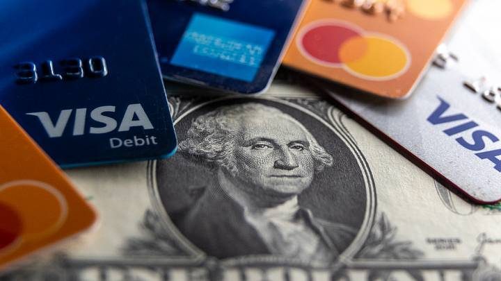 Credit cards and cash on a table, symbolizing the financial planning and protection side of travel budgeting.