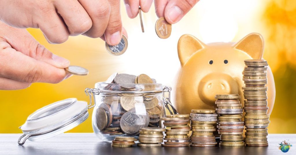 Person managing money and planning a travel budget with cash, notebook and travel items
