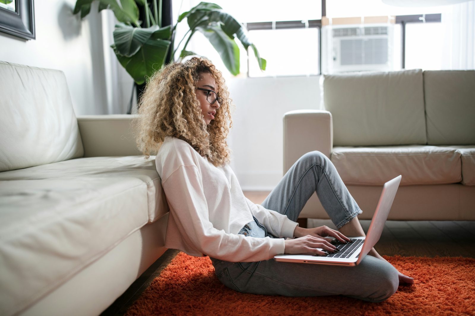 Traveler reviewing a trip budget with flights, accommodation, and transport costs listed