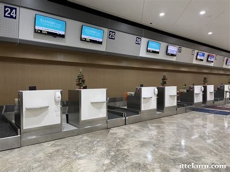 empty airport check-in counters during September, indicating low travel season