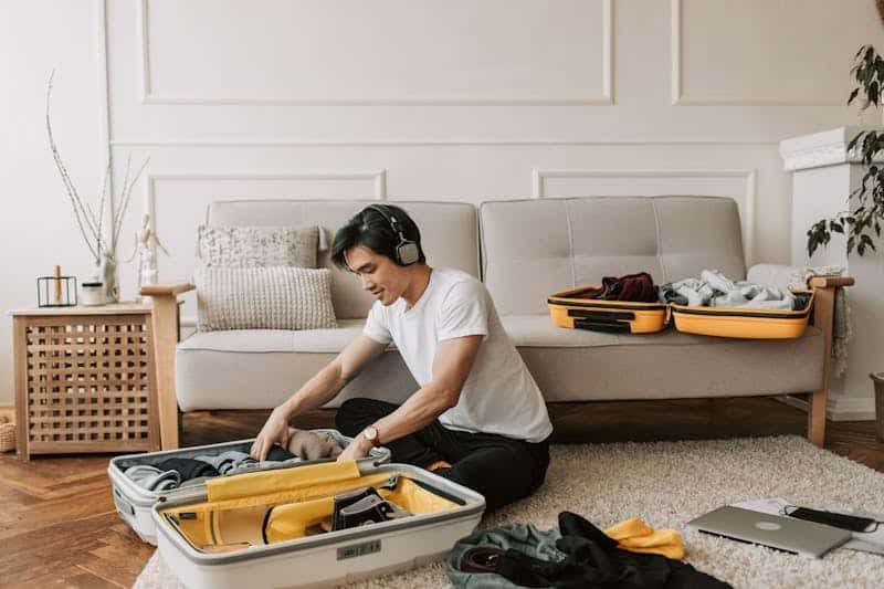 Traveler reviewing itinerary changes and hotel booking details on a laptop