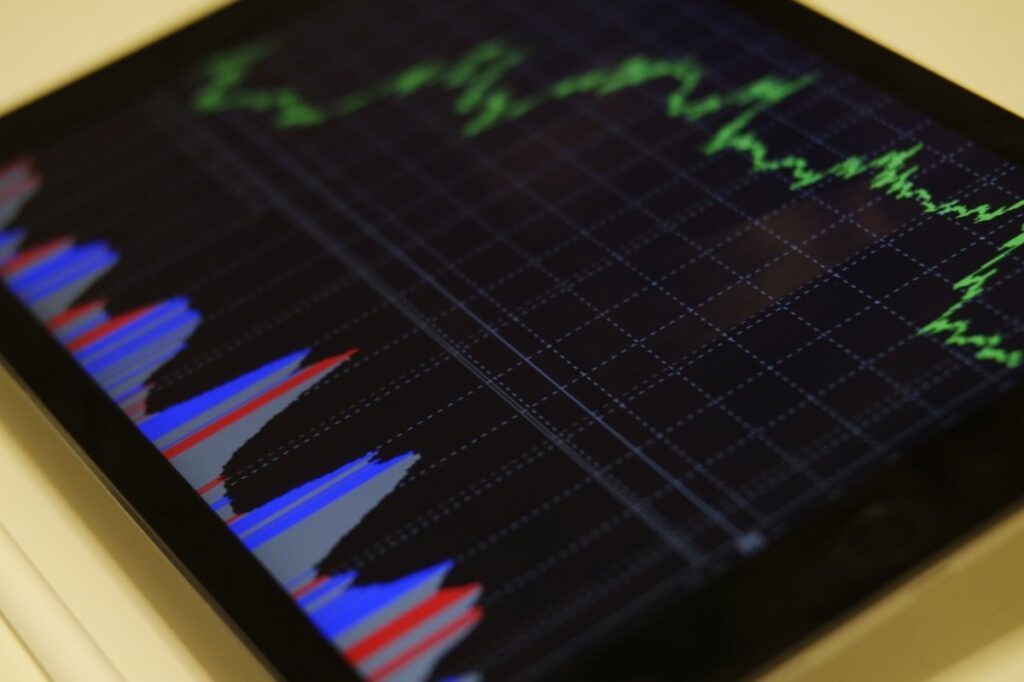 Tablet screen showing green and blue graph lines