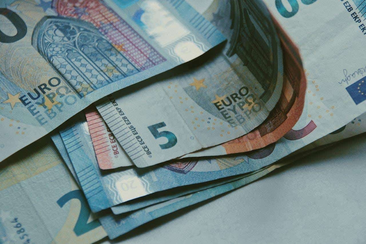 Backpackers comparing travel options between Europe and Southeast Asia