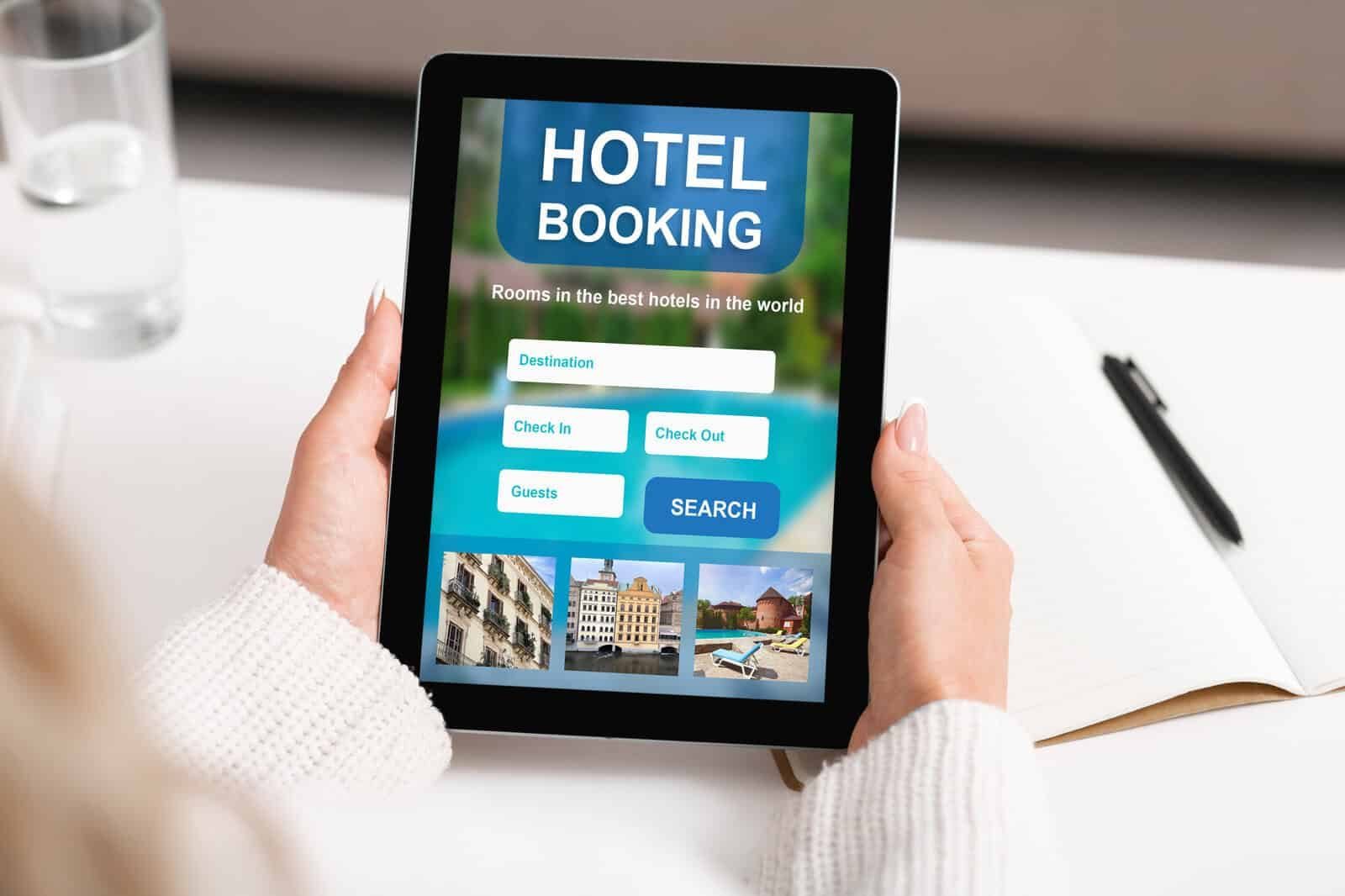 Online hotel booking on tablet for travel accommodation reservations